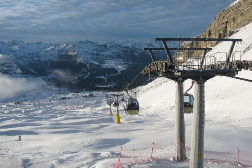 Ski lift over snow-covered ski slopes in Madonna di Campliglio, Italy, which is currently offering good piste-skiing - Weather to ski – Snow report, 19 December 2025