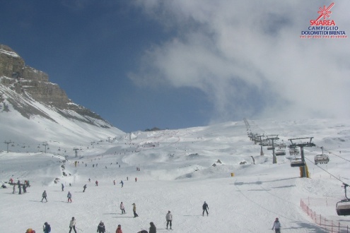 Skiers on the snow-covered slopes of Madonna di Campiglio, Italy – Weather to ski – Snow report, 25 February 2023