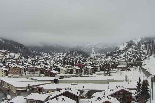 Cloud over the snow-topped buildings in the village in Zermatt, Switzerland – Weather to ski – Snow report 18 January 2024
