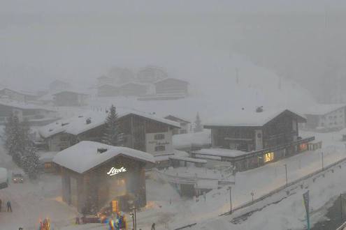 Blizzard and poor visibility looking towards the ski slopes with the village of Lech, Austria in the foreground – Weather to ski – Today in the Alps, 1 February 2022