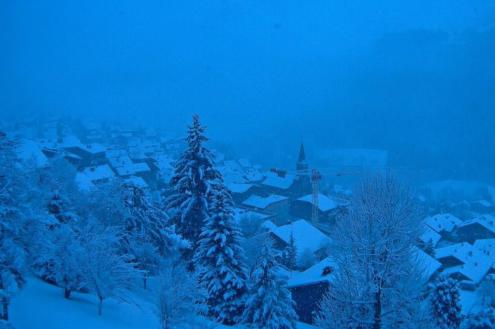 A snowy looking view over the houses of the ski resort of Châtel, France – Weather to ski – Today in the Alps, 14 December 2023