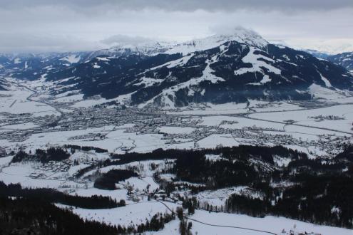 Cloudy skies above the snow-covered valley in St Johann in Tirol, Austria – Weather to ski – Today in the Alps, 20 December 2023