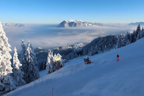 Blue skies over snowy pistes, with skier in the foreground in Garmisch, Germany – Weather to ski – Today in the Alps, 9 January 2024