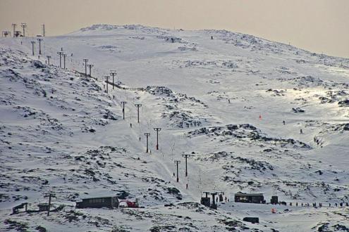 View of the snow-covered slopes and skiers on the skilifts in Glencoe, Scotland – Weather to ski – Snow report, 29 March 2024