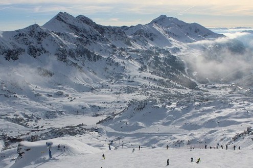 Skiers on the snow-covered ski slopes in Obertauern, Austria - Link to Weather to ski's full "Today in the Alps" report on weather and snow conditions for 6 December 2025