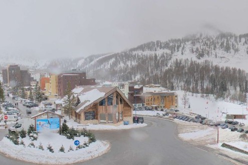 Cloudy skies over the snow-covered mountainside and centre of Isola 2000 ski resort, France -Weather to ski – Today in the Alps, 19 December 2025