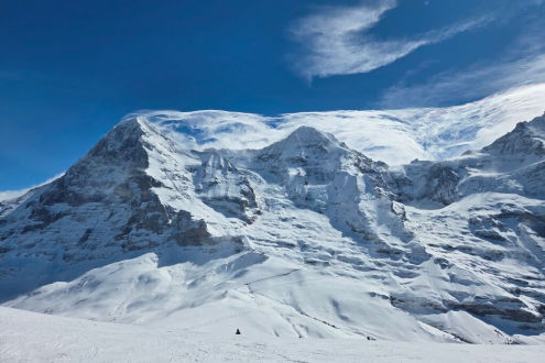 Swirling cloud on the summits of the Eiger, the Mönch and the Jungfrau mountains, viewed from the ski slopes above Wengen, Switzerland – Weather to ski – Today in the Alps, 30 March 2026