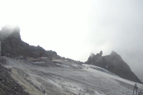 Thin icy base on the ski slopes of the Hintertux glacier, Austria, with thick fog above on its opening day on 2 October 2026