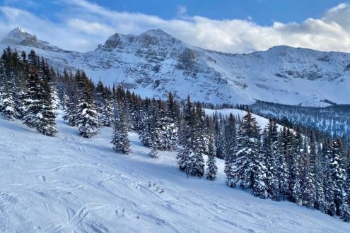 Partly sunny skies over the snow-covered ski slopes in Banff, Canada, on 9 January 2026