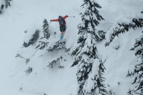 Skier leaping through powder on the slopes of Whistler, Canada, on 15 March 2024
