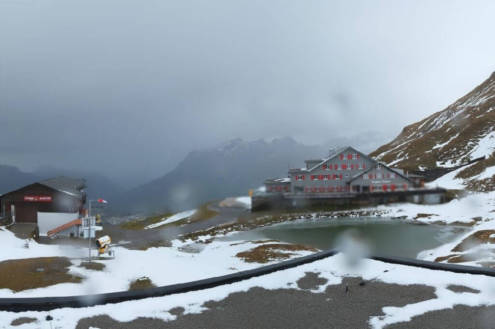 Rain falling at altitude in Engelberg, Switzerland, on 25 October 2026, with views of the lake and chalet-style buildings and mountains beyond - Link to Weather to ski's report on Today in the Alps, 25 October 2026