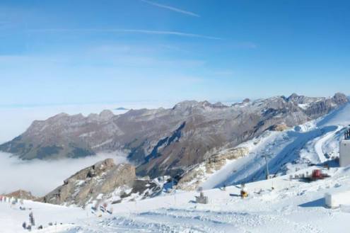Snow-covered slopes and mountains viewed from the top of the Titlis ski area above Engelberg on its opening day on 29 October 2026 - link to Weather to ski's latest Today in the Alps report, 29 October 2026